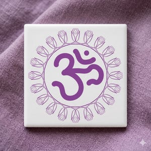 May include: Square white tile featuring a purple Om symbol, encircled by a ring of rose illustrations. The Om symbol is a spiritual icon, often used in meditation and yoga practices. The tile is set against a purple fabric background.