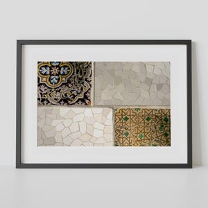 May include: Framed artwork featuring a close-up of mosaic tile patterns. The artwork showcases a variety of textures and colors, including white, beige, black, gold, and green. The mosaic tiles are arranged in a grid-like pattern, creating a visually appealing composition.