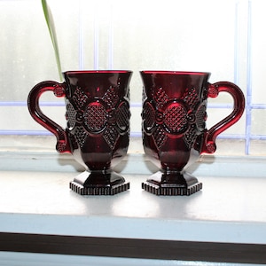 2 Ruby Red Avon Cape Cod Pedestal Mugs Fostoria Unused with Box