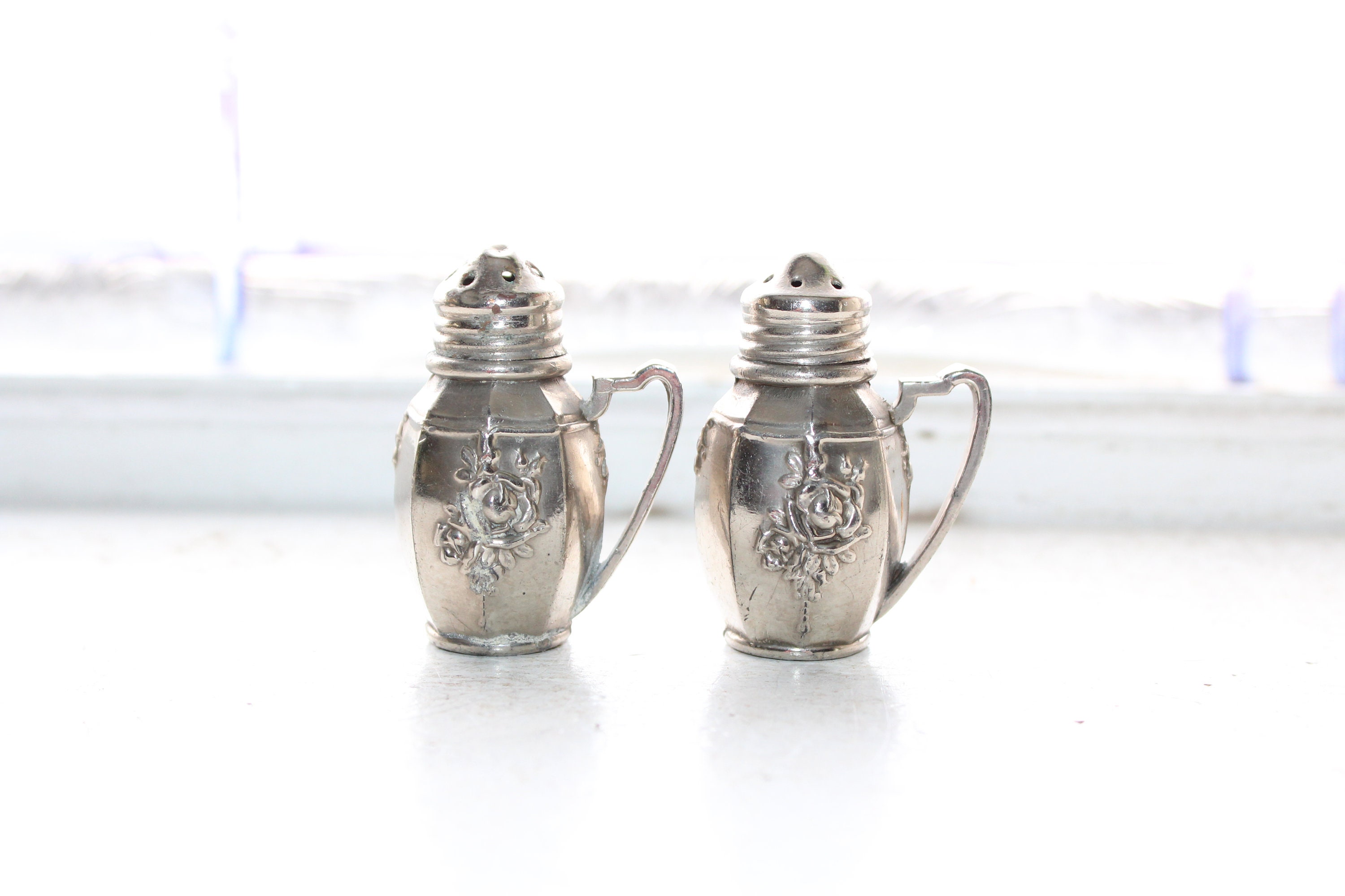 Vintage Salt and Pepper Shakers Embossed Rose Metal with Handles
