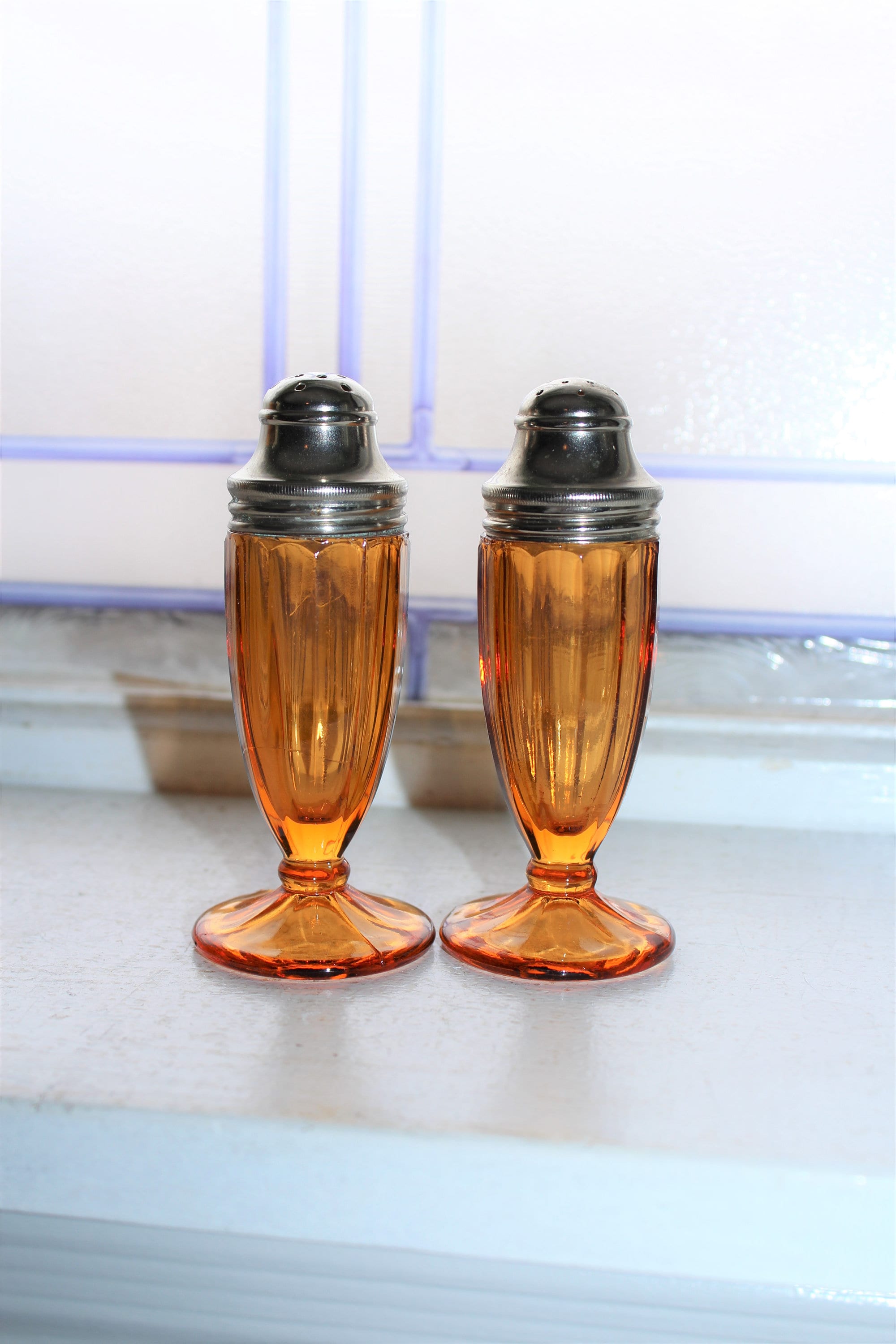 Vintage Amber Glass Salt and Pepper Shakers Panelled Footed 1930s