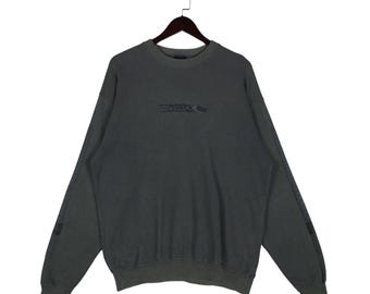 Bluza Vintage O'Neill w rozmiarze L | Wyblakły, grafitowy, szary sweter z okrągłym dekoltem, surfingowy, skateboardowy | Graficzny sweter w stylu ulicznym lat 90. | Luźny, pudełkowy krój