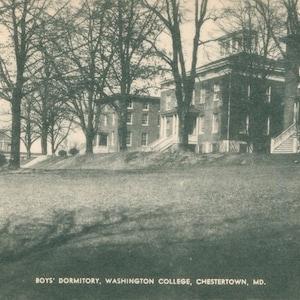 May include: A black and white photo of a brick building with a grassy lawn in front. The building is labeled "Boys' Dormitory, Washington College, Chestertown, MD."