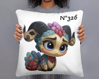 May include: White square pillow featuring a colorful cartoon creature with large blue eyes, horns, and a feathered tail. The pillow has the number "N°326" printed in black.