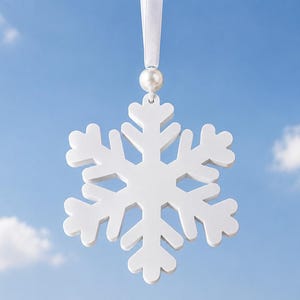 May include: A white snowflake ornament with a smooth finish, suspended by a white satin ribbon and accented with a single small white pearl bead at the top. The snowflake features a classic six-pointed geometric design with symmetrical branches.