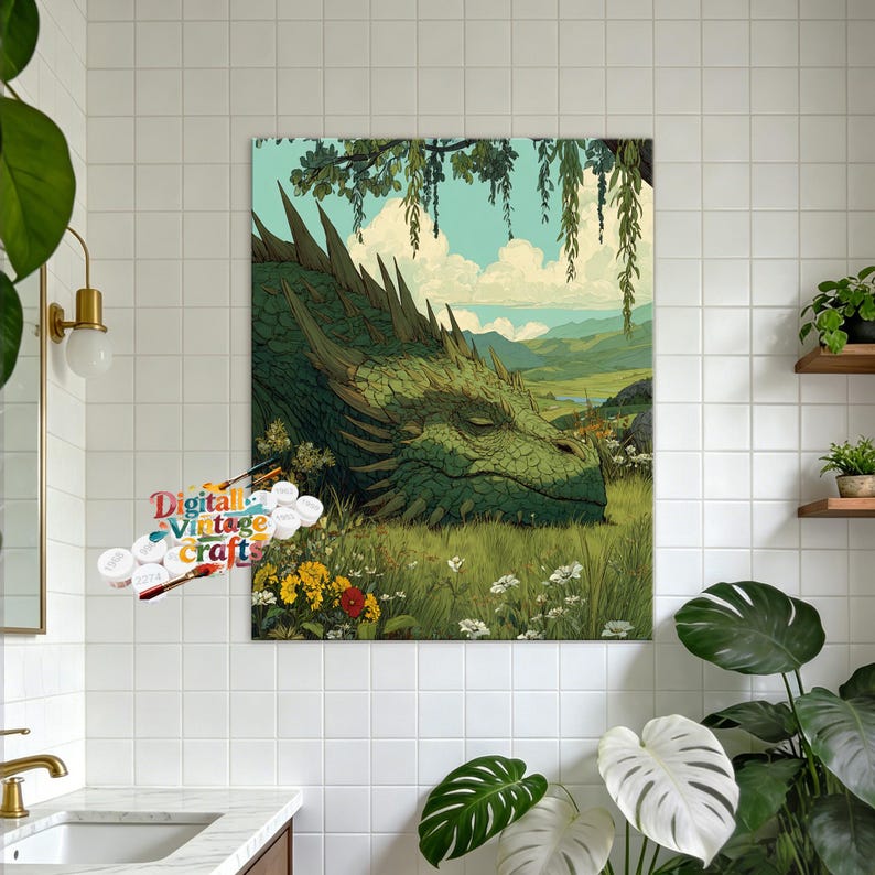May include: A rectangular paint-by-numbers canvas featuring a large green dragon resting in a grassy meadow with yellow and white wildflowers, under a light blue sky with clouds and hanging willow branches, with a paint set labeled Digital Vintage Crafts.