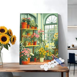 May include: A paint-by-numbers canvas showing a sunlit greenhouse with potted plants. The image features shelves of flowers, a large window, and a vase of sunflowers. Paint pots and brushes are in the foreground.