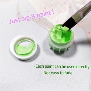 May include: A small plastic container filled with bright lime green acrylic paint, accompanied by a matching lid and a paintbrush tip dipped into the paint. The text reads: Just sip & paint !, Each paint can be used directly, Not easy to fade.