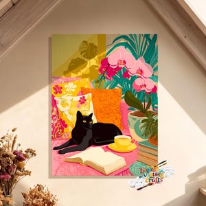 May include: A colorful digital illustration featuring a black cat resting on a pink surface next to an open book, a yellow teacup, and a potted pink orchid. The scene includes patterned yellow and orange pillows and green foliage in the background.