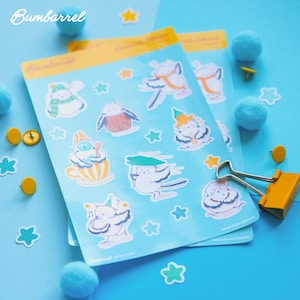 May include: Two sheets of stickers featuring whimsical bird illustrations in various poses, with star and pom-pom accents. The stickers are on a light blue background, with the brand name "Bumbarrel" visible in the top left corner.
