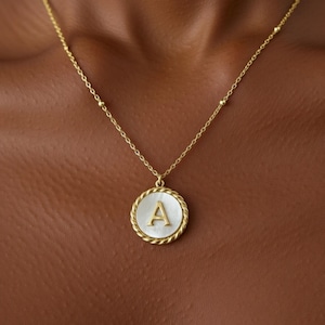 May include: A set of three ceramic mugs with a speckled, matte finish. The mugs are in shades of cream, light gray, and dark gray. Each mug has a simple, minimalist design, perfect for coffee or tea.