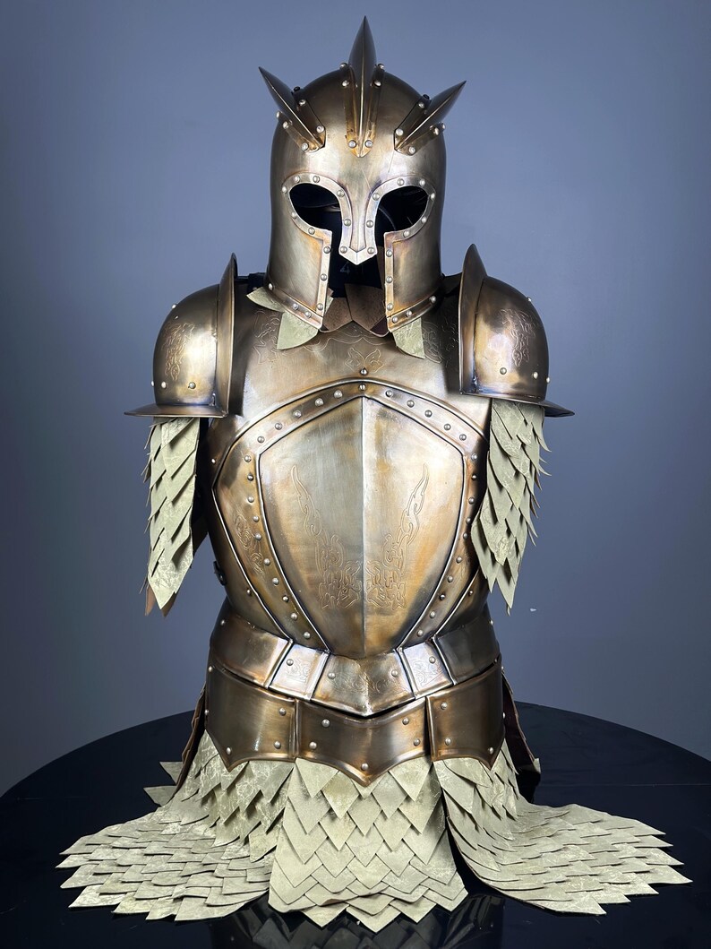 May include: A bronze-colored suit of armor with a helmet featuring multiple spikes. The breastplate and shoulder guards are riveted and detailed. The armor includes a skirt of overlapping, scale-like pieces.