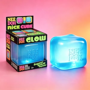 May include: A blue translucent squishy cube toy labelled Nee Doh Nice Cube. The packaging box is black with neon green and pink text, featuring the words Nee Doh Glow and Super Solid Squish. The cube itself is a smooth, soft, square-shaped object.