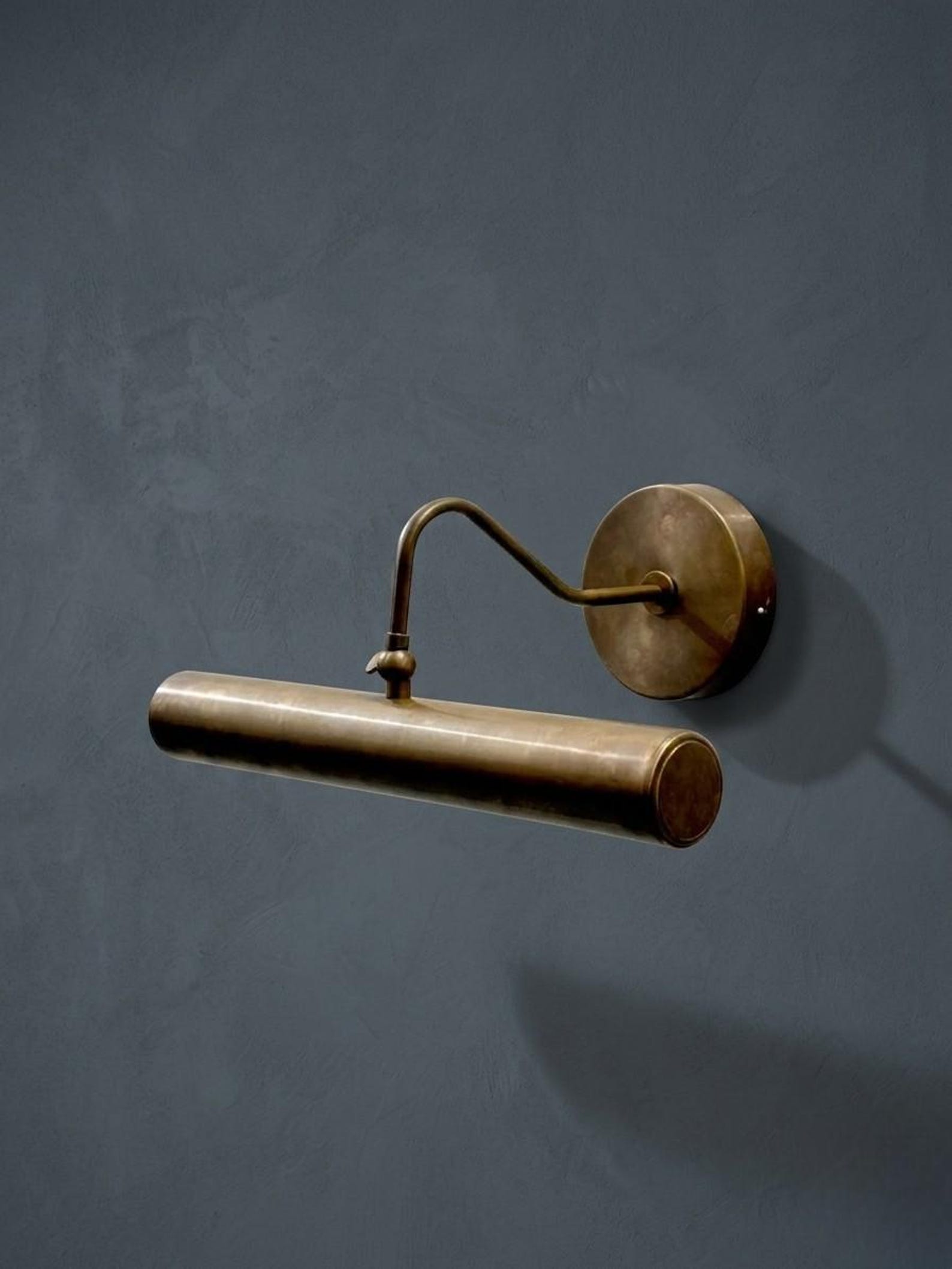 Solid brass picture light for a cowgirl coastal living room