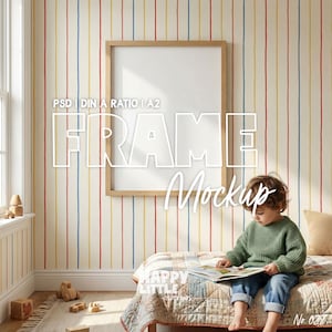 May include: A wooden framed mockup with the text "FRAME Mockup" is displayed on a wall with vertical stripes in red, yellow, and blue. A child in a green sweater and blue jeans sits on a bed reading a book. The room has a window and wooden toys.
