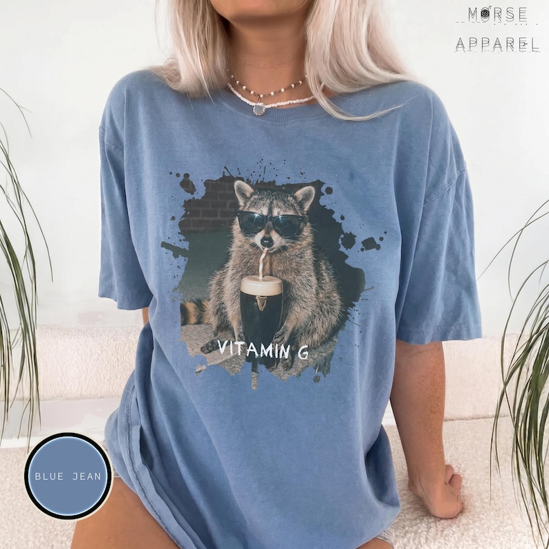 Funny Raccoon Drinking Beer Vitamin G T-Shirt, Comfort Colors® Guinness Tee, Pub Party Shirt, Unisex Trendy Meme Graphic Top Blue Jean
