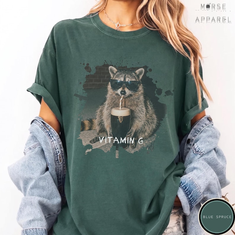 Funny Raccoon Drinking Beer Vitamin G T-Shirt, Comfort Colors® Guinness Tee, Pub Party Shirt, Unisex Trendy Meme Graphic Top Blue Spruce