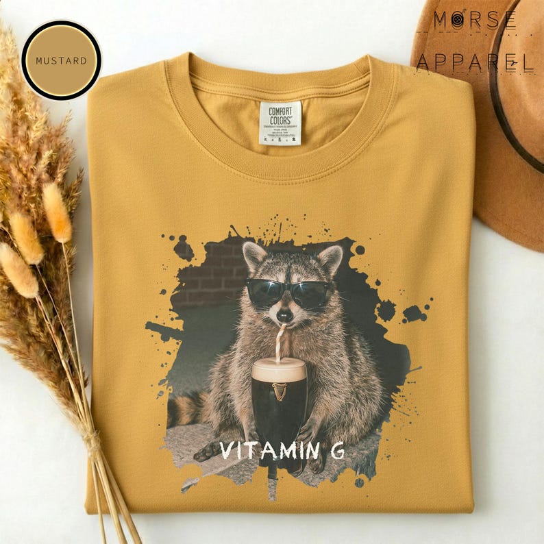 Funny Raccoon Drinking Beer Vitamin G T-Shirt, Comfort Colors® Guinness Tee, Pub Party Shirt, Unisex Trendy Meme Graphic Top Mustard