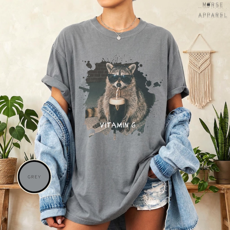 Funny Raccoon Drinking Beer Vitamin G T-Shirt, Comfort Colors® Guinness Tee, Pub Party Shirt, Unisex Trendy Meme Graphic Top Grey