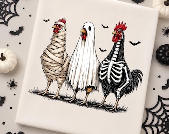 May include: A square white canvas print featuring an illustration of three chickens in costumes standing on grass. The left chicken is wrapped in mummy bandages, the center chicken wears a white ghost sheet, and the right chicken has a skeleton print.