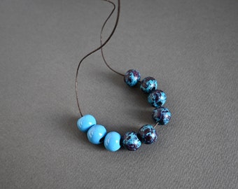 Blue long necklace with round ceramic beads, adjustable length