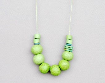 Light green ceramic necklace with round beads and adjustable length