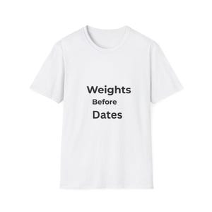 May include: White t-shirt with the text "Weights Before Dates" in black, centered on the front. The shirt has a crew neck and short sleeves. The overall design is simple and clean.