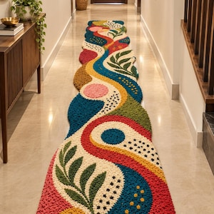 May include: A long, narrow runner rug featuring a textured, tufted surface with a vibrant, abstract pattern. The design includes organic shapes in shades of deep blue, mustard yellow, forest green, cream, and bright red, accented with leaf motifs.