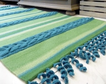 Unique handwoven woolen rug with cable knitted plates and crocheted fringies. Blue and green floor rug. Art home textile.