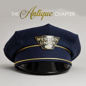 May include: A navy blue Western Union hat with a gold emblem and trim. The hat has a shiny black brim and the text "The Antique Chapter" in gold script.