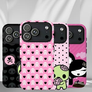 May include: Three phone cases with unique designs. One is black with skulls, another is pink with skulls and hearts, and the third is pink with a cartoon character. The cases have a glossy finish and are designed for a smartphone.