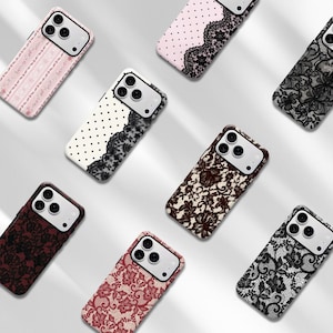 May include: A collection of eight smartphone cases featuring various lace and polka dot patterns in colors including black, white, pink, and deep red. Each case has a rectangular camera cutout with three circular lens openings on the top left.