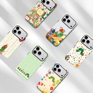 May include: Six smartphone cases featuring The Very Hungry Caterpillar illustrations. Designs include a grid with apples, a caterpillar with fruit, a striped pattern with a caterpillar, a green striped background, a star pattern, and a light background with fruit.