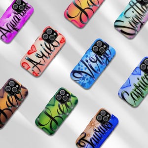 May include: A collection of smartphone cases featuring various zodiac signs in black cursive lettering. Each case displays a unique color gradient and pattern, including clouds, hearts, stars, and sunbursts, with cutouts for the camera lens array.