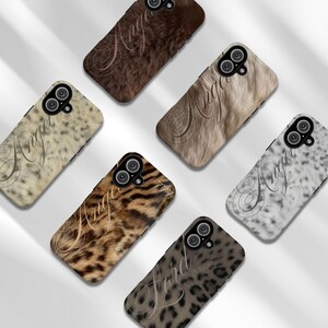 May include: Six rectangular smartphone cases featuring various animal print patterns including leopard, cheetah, and tiger textures. Each case displays the word Angel or Lord in a cursive script font and includes a circular camera cutout at the top.
