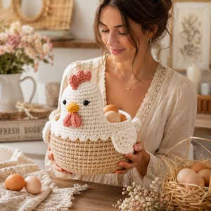 May include: A handmade crochet chicken basket, holding several brown eggs. The basket is beige with a white chicken head, featuring a pink comb and wattle, and black eyes. The basket is designed to resemble a chicken.
