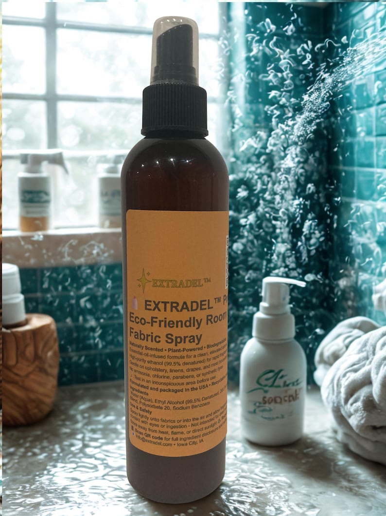 May include: A brown bottle of EXTRADEL Eco-Friendly Room Fabric Spray with a black spray nozzle and a tan label. The label includes product information. A white bottle with a pump dispenser is to the right.