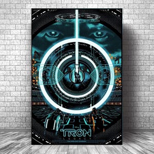 May include: A poster for the film "Tron: Legacy" with a futuristic design, featuring a central circular element and the film's title. The colour scheme is black and teal, with geometric shapes and glowing lines. The poster is displayed on a brick wall.