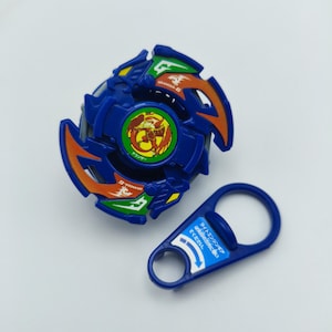 May include: A blue and orange toy with a circular design and a separate blue handle. The toy has a central emblem with a dragon and Japanese text. The handle has Japanese text and arrows.
