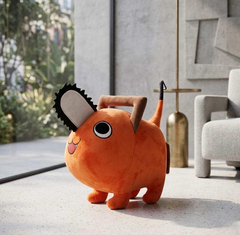 May include: An orange plush toy shaped like a cartoon dog with a chainsaw head. The toy has large black and white eyes, a smiling mouth, and a brown handle. The dog has four small legs and a tail. The toy is sitting on a light-colored floor.