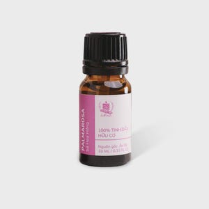 May include: A small amber glass bottle with a black ribbed screw cap, containing 10 ml of essential oil. The white and pink label features the text PALMAROSA, 100% TINH DẦU HỮU CƠ, and 0.33 FL OZ, along with a small graphic of a candle and leaves.