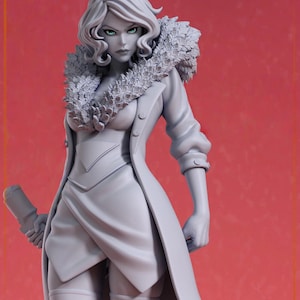 May include: A grey figurine of a woman in a long coat with a fur collar. The figure has wavy hair and is holding a cylindrical object. The background is a solid red colour.