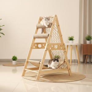 May include: A-frame cat tree made of light wood, featuring a hammock and two levels with cylindrical scratching posts. Two cats are resting on the structure. The cat tree sits on a round woven mat.