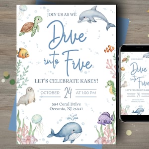 May include: A white ceramic mug with a black handle and the text "But First, Coffee" in a handwritten style. The mug is on a white surface. The mug is likely for hot beverages.