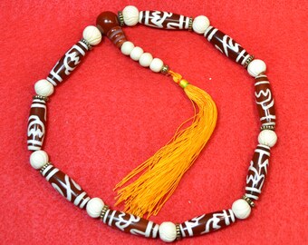 Nine dzi Buddhist prayer mala with the double lotus