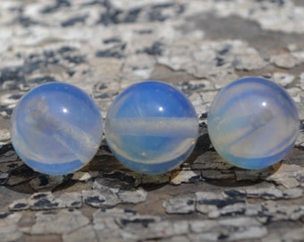 Opalite 12mm rounds luminescent blue sea glass
