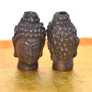 Buddha head amulet in brass BD395