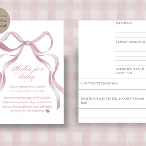 May include: Two white rectangular cards with a watercolour pink ribbon illustration. The left card features the text Notes for baby, instructions for a Polaroid photo, and a message. The right card has lines for prompts including My name is, I know you because, A song you should listen to is, I can't wait to show you, and Something I want to tell you about mom & dad.