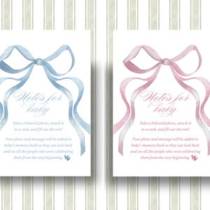 May include: Two baby shower cards with watercolour bows. One card has a blue bow, the other a pink bow. The cards read "Notes for Baby" and include instructions to attach a photo and write a message for a baby's memory book.