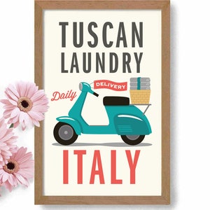 May include: A vintage-style illustration of a teal scooter with a basket of laundry on the back. The scooter has a red flag that says "Delivery". The text "Tuscan Laundry Daily Italy" is written in a retro font.